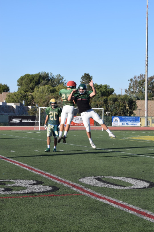 Seniors Callum Lapper and Kevin Russell celebrate a defensive stop during practice on October 19th. 