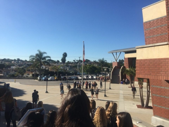 Mira Costa High School students in all grades patiently wait to walk to the Manhattan Beach City Hall for the “Walkout for Peace” protest. This protest took place Monday to protest against President-Elect Donald Trump and other issues. 