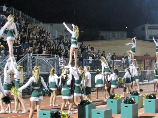 The Mira Costa Cheer Team performs their routine acrobatics during a time out.