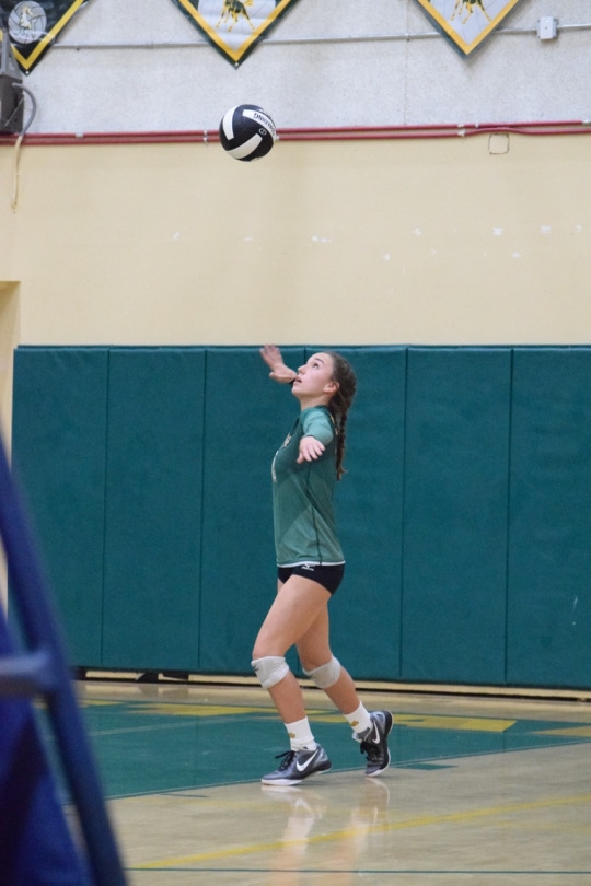 Junior Lea Ungar serves the ball in Mira Costa’s quarterfinal game against Edison High School.