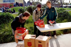 Sophomores Max Haber, Sean Parsa and Will Bond collect canned goods for the ASB canned food drive outside the ASB room today during lunch.  The canned food drive has provided food to hundreds of families in need in past years.