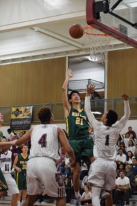Senior Brandon Chan shoots after recovering a rebound in Tuesday night’s victory versus the Torrance boys basketball team.