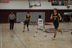 Junior Bobby Barkley dribbles the ball down the court after Torrance lost possession of the ball.  