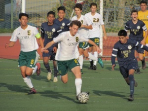 Mira Costa Senior Trevor Taub kicks the ball away from his Animo opponent in an attempt to advance towards the goal.