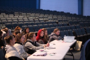 A panel of ASB students watch and judge as students preform.  