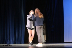 ASB students dance on stage between tryouts. 