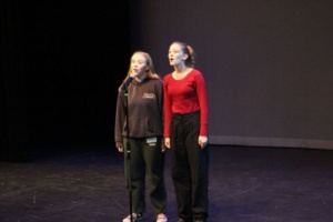 Freshman Ansley Rowell and Junior Molly Desimone sing their song at the Benefit Show Tuesday night. They sang Sing Song which was written by them.