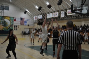 Senior Laura Sheckter shoots the balls after dribbling towards the basket. The Mira Costa High School girls basketball team played Edison on February 16th in the second round of CIF. 