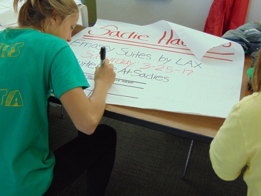 ASB freshman Rochelle Scott decorates posters for Sadie Hawkins Dance. Rochelle and other ASB members have been preparing for Sadie Hawkins since mid February after Winter Formal.