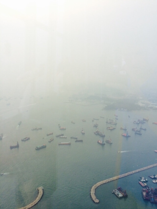 Tourists view the tallest building in Hong Kong, the International Commerce Center which overlooks the ships of the Port of Hong Kong on Monday the 10th, 2017. This port provided homes for hundreds of ships and is overlooked by the Commerce Center everyday.