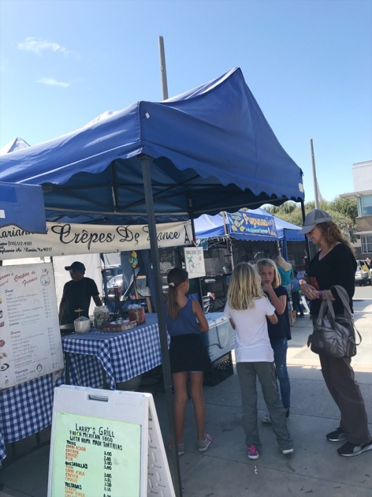 A group of girls ordered crepes from the “Crepes De France” stand at the Market. This gave them a chance to experience food from other cultures, and in this case French food.(32)