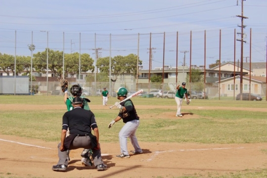 Junior Dajon Liava'a allows the ball to pass by him after a poor pitch from Inglewood. Liava'a advanced to first base due to a series of bad throws from the pitcher. 