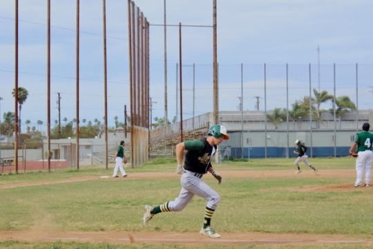 Junior Bash Alexiades makes his way to first base. He was unable to complete a home run.