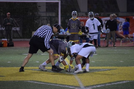 Peninsula draw taker and Costa draw taker, Alej Ruiz, set up at center field to take the draw. One player from each team goes in the circle to take the draw when the game is starting, when the second half begins, or after a team scores.