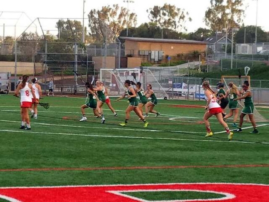 Redondo varsity lacrosse player plays tough offense against Costa on Tuesday April 25. Costa players held their ground against Redondo at the twelve line to prevent them from taking a shot. 