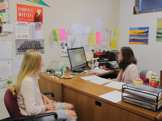 Sophomore Riley Hazelrigg sits down with her counselor and discusses her class selections for next year during Mr. Brown’s zero period class. Every student in the class was given the opportunity to confirm their upcoming schedule with their counselor.