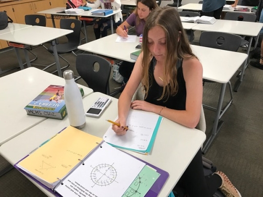 Sophomore Hailey Dumont studies before taking her make-up quiz in Ms. Baral’s math class during second office hours on Wednesday. Many people went to her classroom to make-up the quiz that happened the previous day.