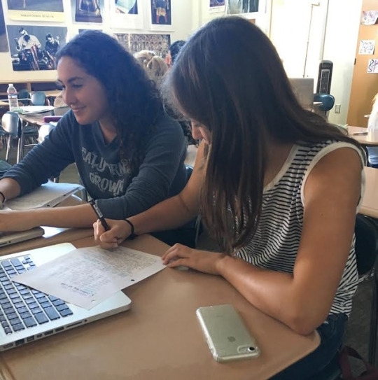 Junior PJ Sundeen works on homework during first office hours in the Mrs. Park’s classroom. Mrs. Park’s room is a popular spot to be during office hours to get homework done, eat and listen to music. 